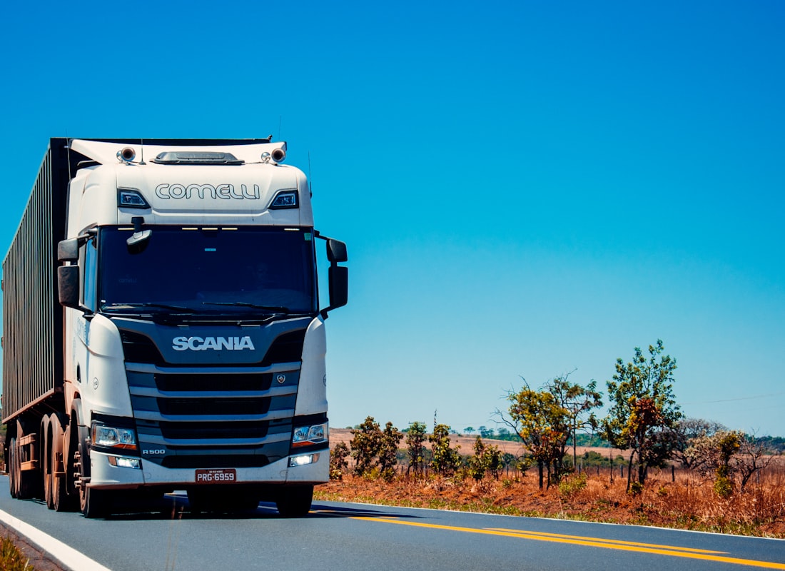 Logistics truck on an open highway under blue sky